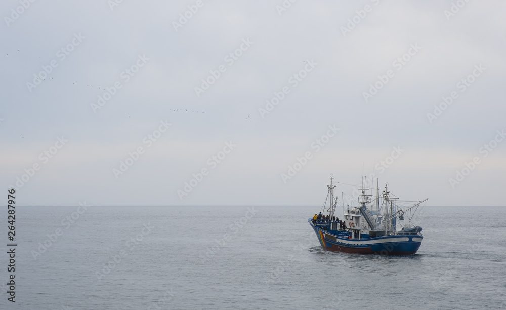 fishing boat in ocean waters fishing boat in ocean waters