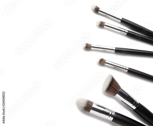 Creative concept beauty fashion photo of cosmetic product make up brushes kit on white background.