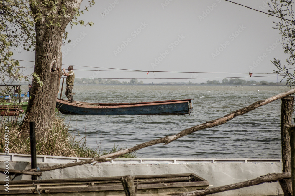 Fototapeta premium Man in a boat