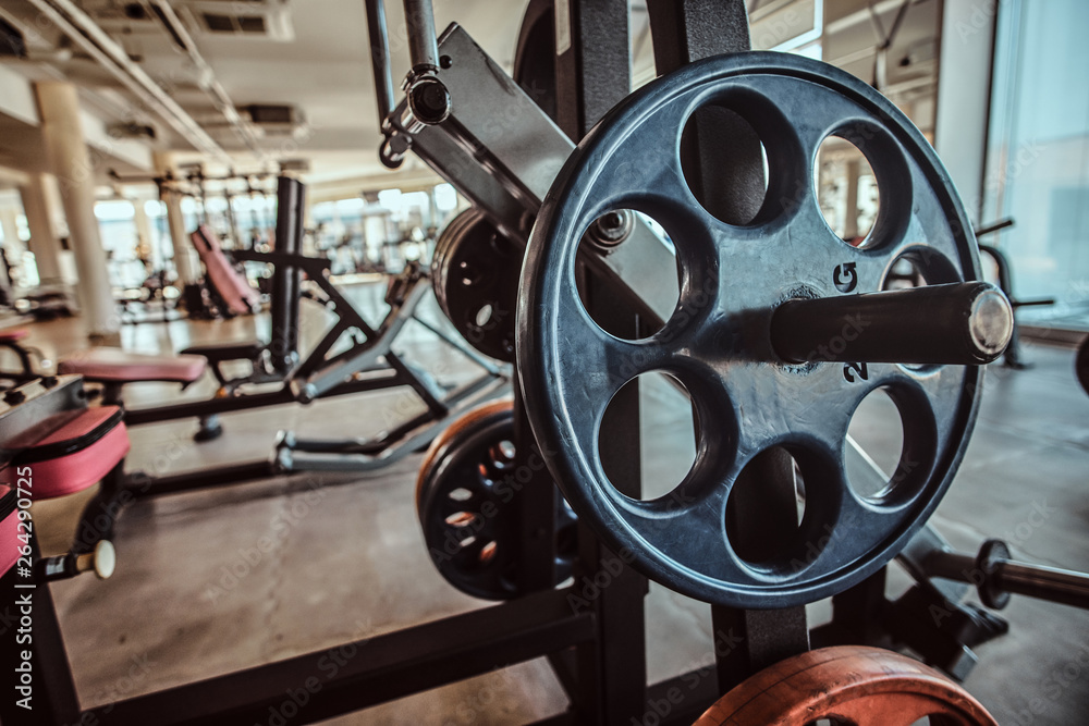 Fototapeta premium Closeup photo shoot of training apparatus in sunny gym.
