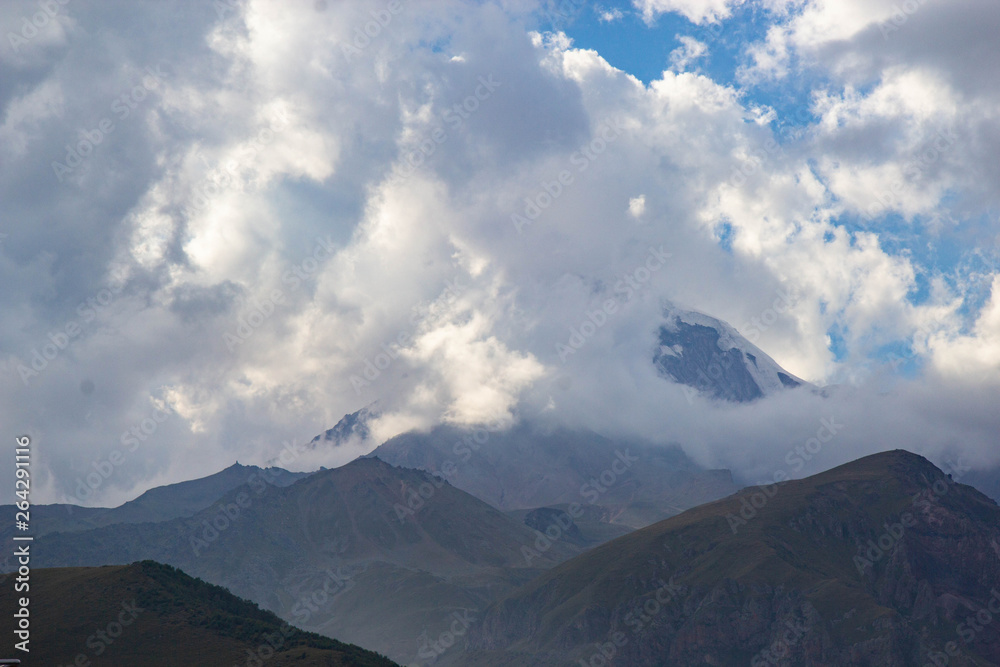 View of Caucasus mountains near Kazbek peak, Stepantminda, Georgia