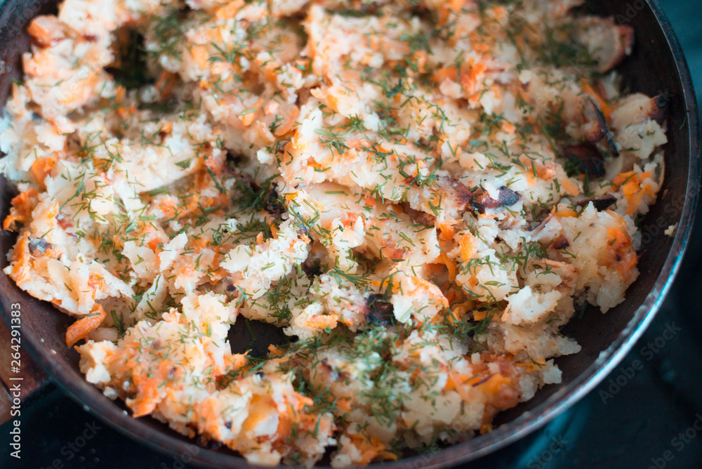 Potatoes with vegetables on a frying pan Potatoes with vegetables on a frying pan