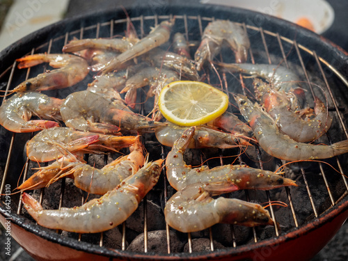 Raw uncooked prawns on bbq. Cooking time.