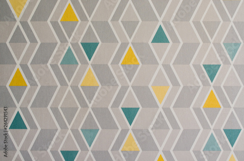Triangles pattern on the texture of space, abstract background. Simple geometric illustration. Yellow, gray and green triangles.