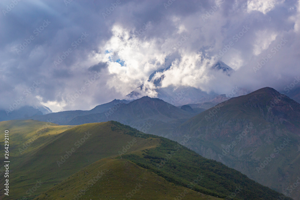 View of Caucasus mountains near Kazbek peak, Stepantminda, Georgia