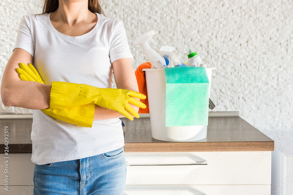 professional home cleaning. A young woman cleans the apartment. Close-up, rags, sponges and bucket, supplies staff. professional home cleaning. A young woman cleans the apartment. Close-up, rags, sponges and bucket, supplies staff.