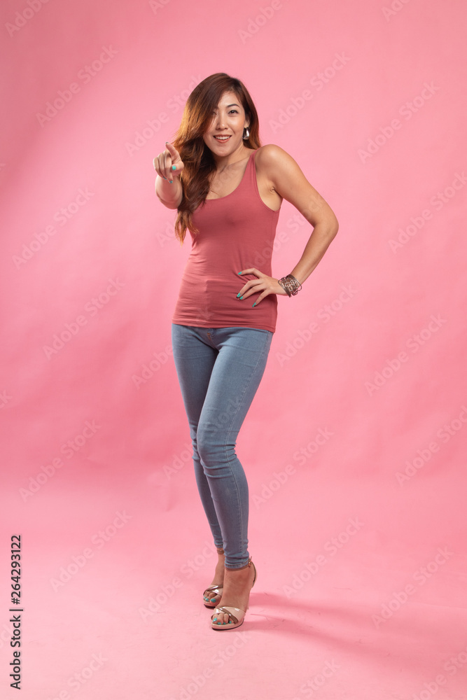 Full body of beautiful young asian woman pointing. Full body of beautiful young asian woman pointing.