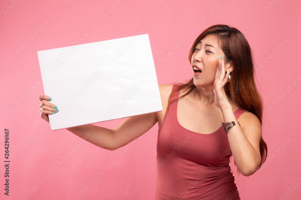 Young Asian woman  surprise with  white blank sign.