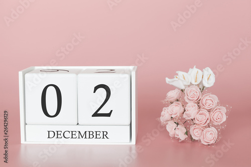 December 02nd. Day 2 of month. Calendar cube on modern pink background, concept of bussines and an importent event. photo