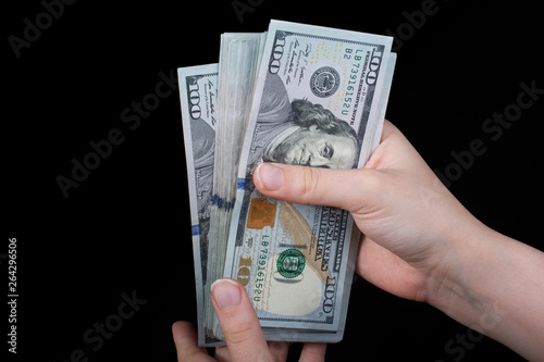 Hand holding American dollar  isolated on white background photo