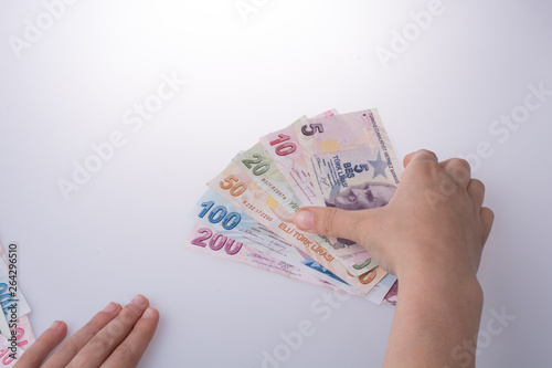 Hand holding Turksh Lira banknotes  in hand photo