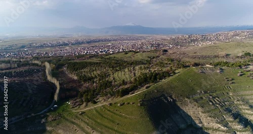 4K aerial of flying over a beautiful green forest in a rural landscape , Armenia