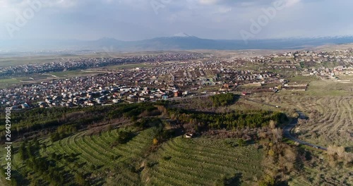 4K aerial of flying over a beautiful green forest in a rural landscape , Armenia