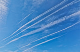Airplane trail on a clean blue sky in Washington DC