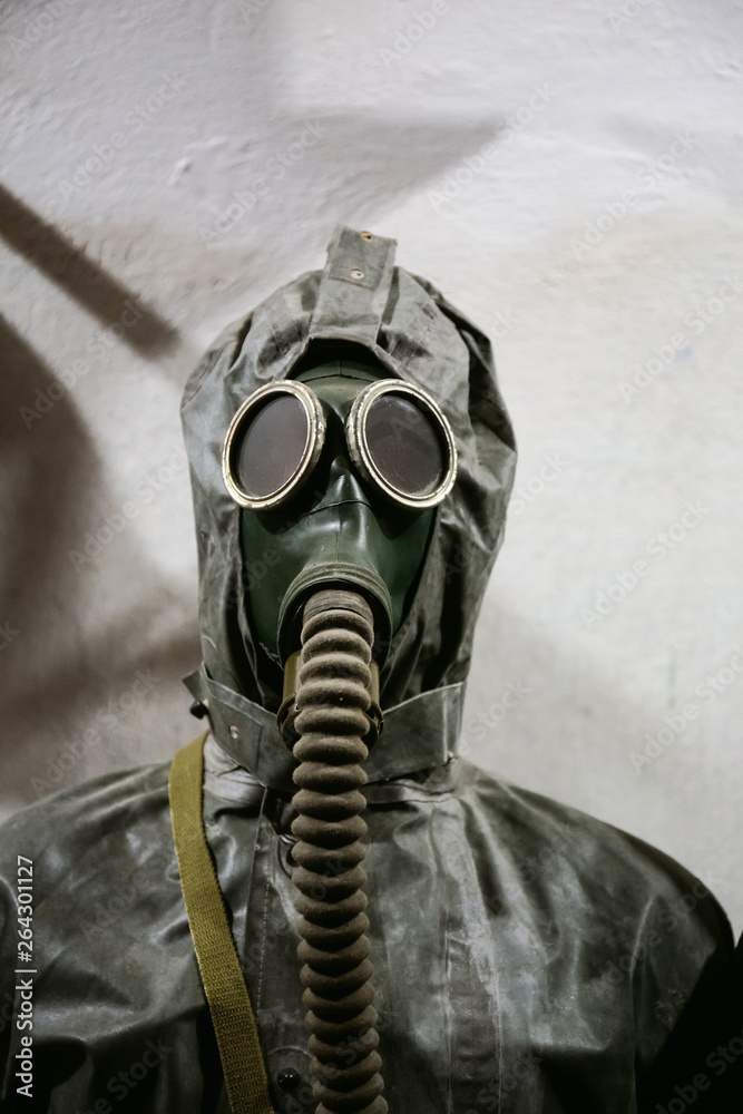 Vintage gas mask and radioactive protection suit Stock Photo | Adobe Stock