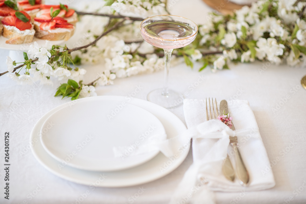 Laying and decor of the wedding banquet table. Plates, knives, forks, glasses, plates, flowers, snacks and fruit. The main thing in the details. Laying and decor of the wedding banquet table. Plates, knives, forks, glasses, plates, flowers, snacks and fruit. The main thing in the details.