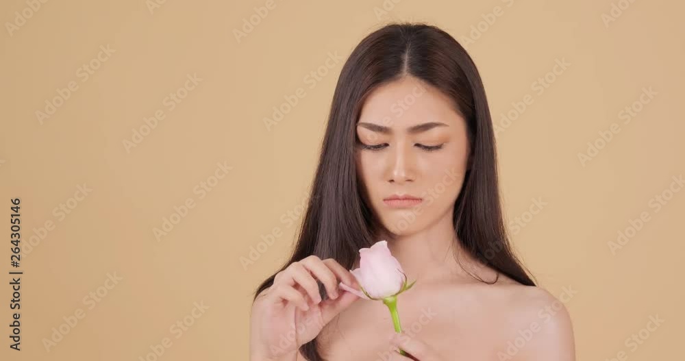 Asian beautiful woman throwing rose with annoyed emotion. Asian beautiful woman throwing rose with annoyed emotion.