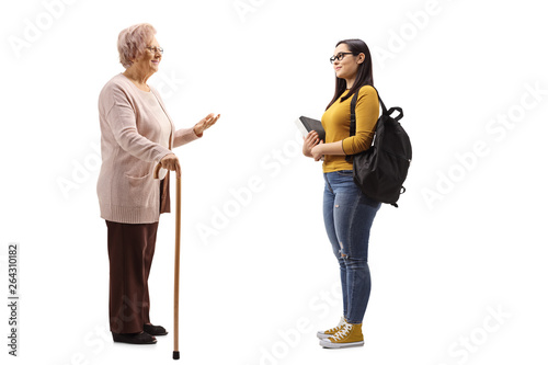 Senior woman and a female student standing and talking