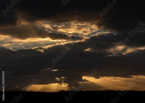 Sunset Beams Behind Cloud