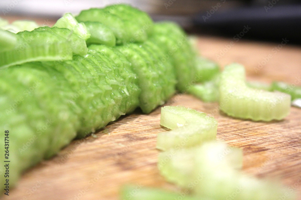 Macro sliced celery, sliced celery on chopping board Macro sliced celery, sliced celery on chopping board