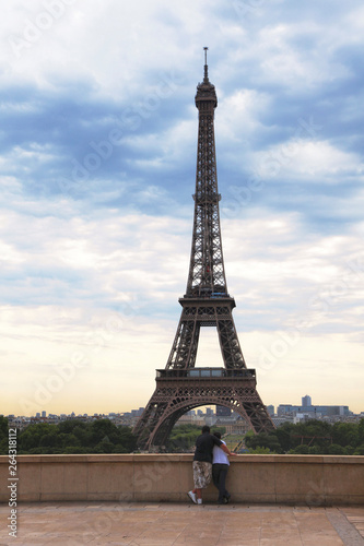 Eiffel tower in Paris with couple. © Composer