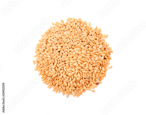 Golden flax seeds on a white background