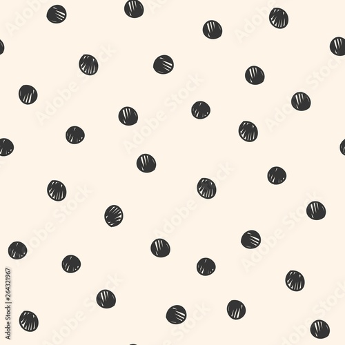 Seamless repeat pattern with hand-drawn scribble sketched polka dot on a cream background