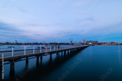 View of St Kilda pier at dusk towards the beach.