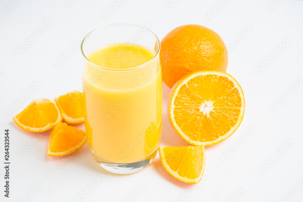 Fresh squeezed orange juice on the rustic background. Selective focus. Shallow depth of field. Fresh squeezed orange juice on the rustic background. Selective focus. Shallow depth of field.