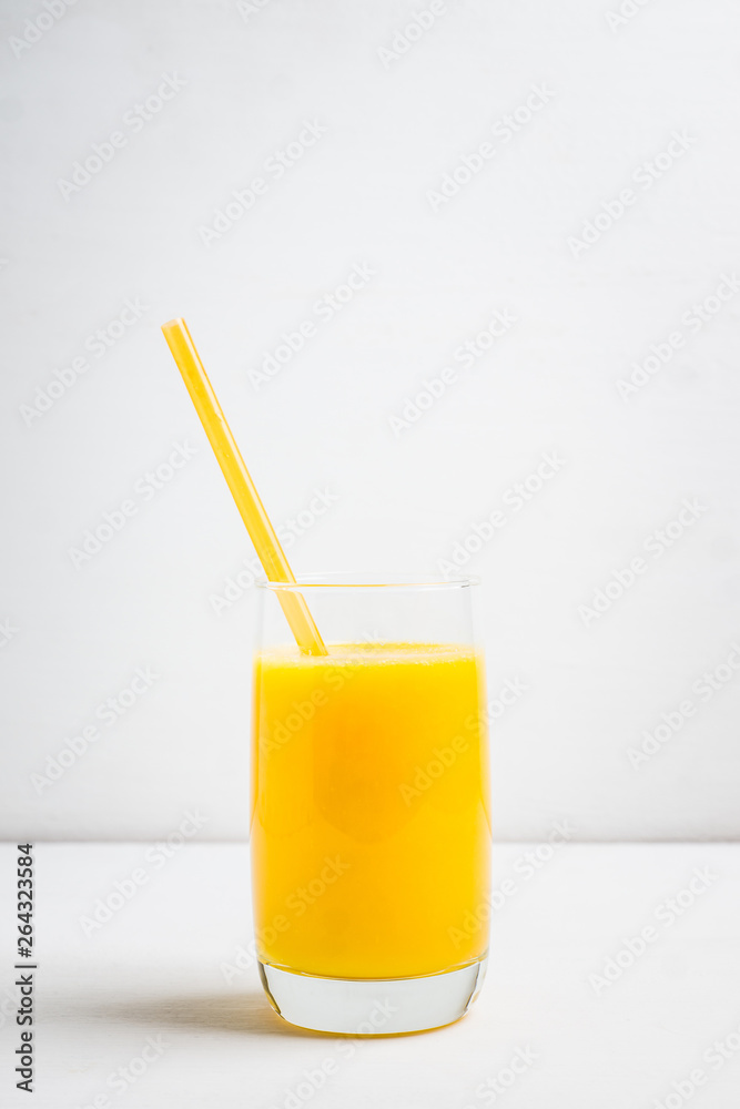 Fresh squeezed orange juice on the rustic background. Selective focus. Shallow depth of field. Fresh squeezed orange juice on the rustic background. Selective focus. Shallow depth of field.