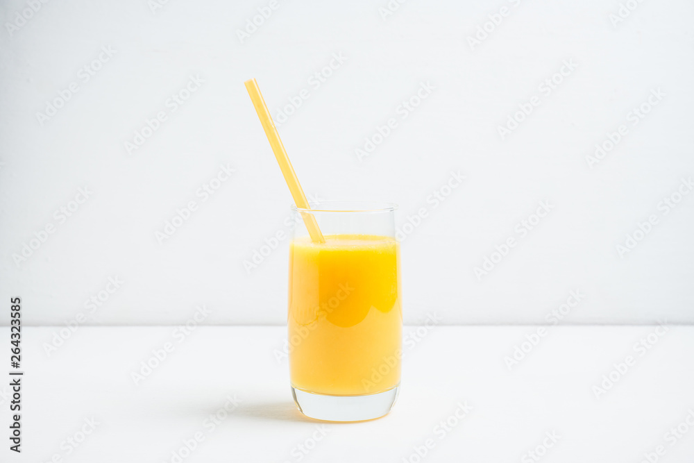 Fresh squeezed orange juice on the rustic background. Selective focus. Shallow depth of field. 