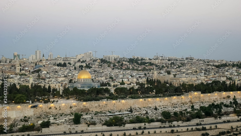 dawn view of the dome of the rock from the mount of