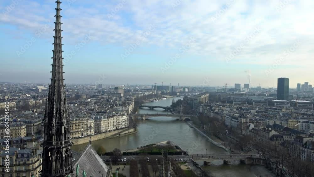 4K, Elevated view of Paris and Seine river from Notre Dame Cathedral on winter day, observing the city from the top of the church. Famous touristic places and popular travel destinations in Europe-Dan 4K, Elevated view of Paris and Seine river from Notre Dame Cathedral on winter day, observing the city from the top of the church. Famous touristic places and popular travel destinations in Europe-Dan