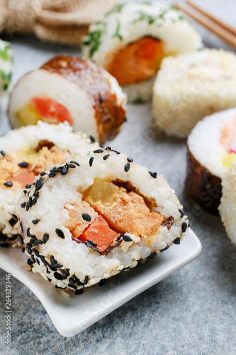 Sushi set on grey stone background.