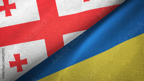 Georgia and Ukraine two flags textile cloth, fabric texture