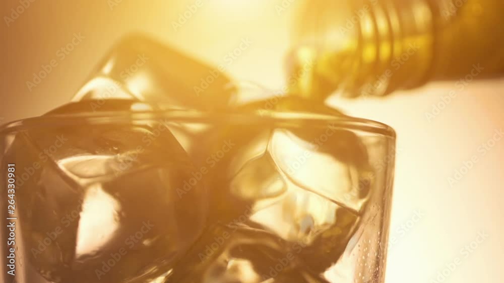 Cinemagraph loop - pouring scotch whiskey over ice