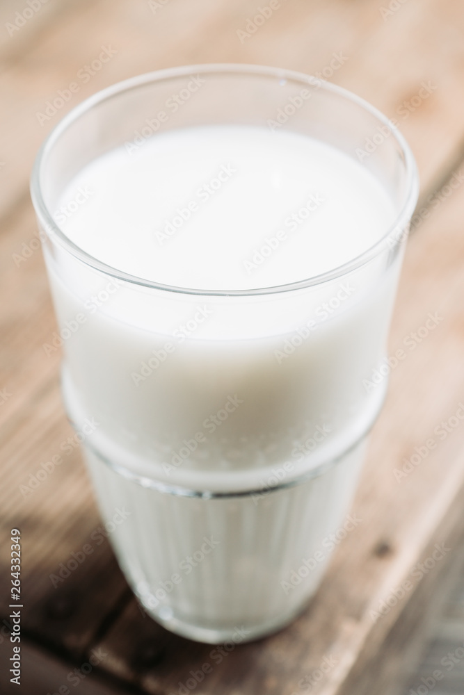 Glass of cold milk on the rustic background. Selective focus. Shallow depth of field. Glass of cold milk on the rustic background. Selective focus. Shallow depth of field.