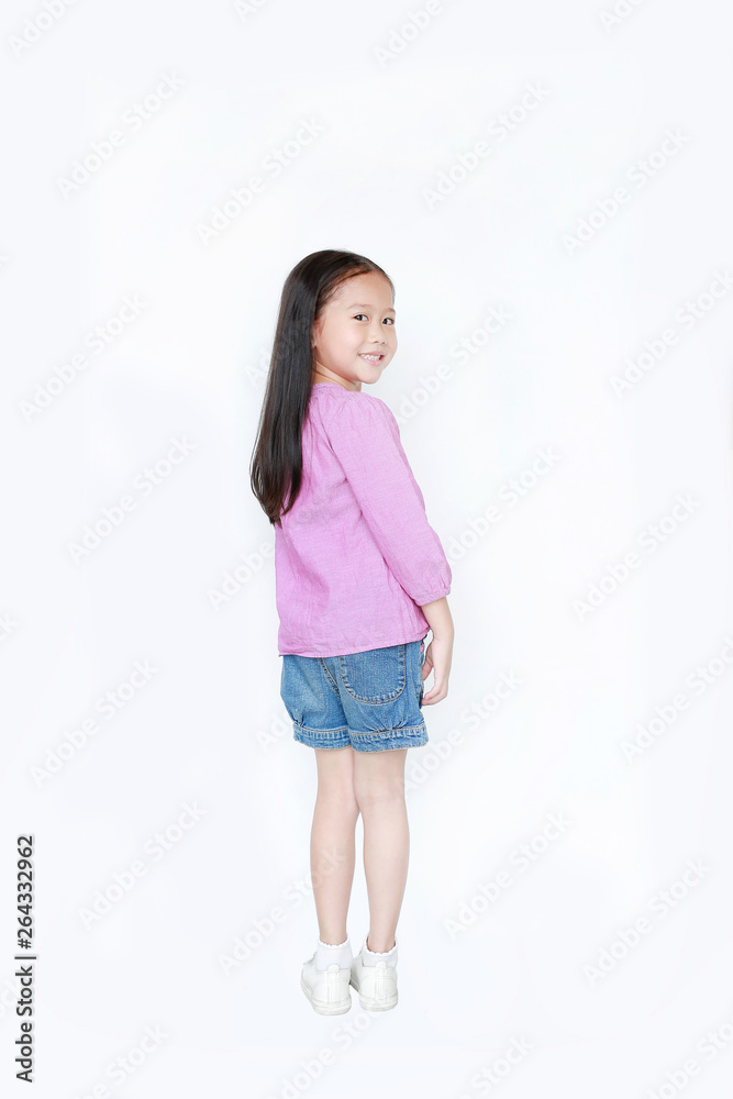 Rear view smiling little child girl over white background. Freedom kid movement concept. Rear view smiling little child girl over white background. Freedom kid movement concept.