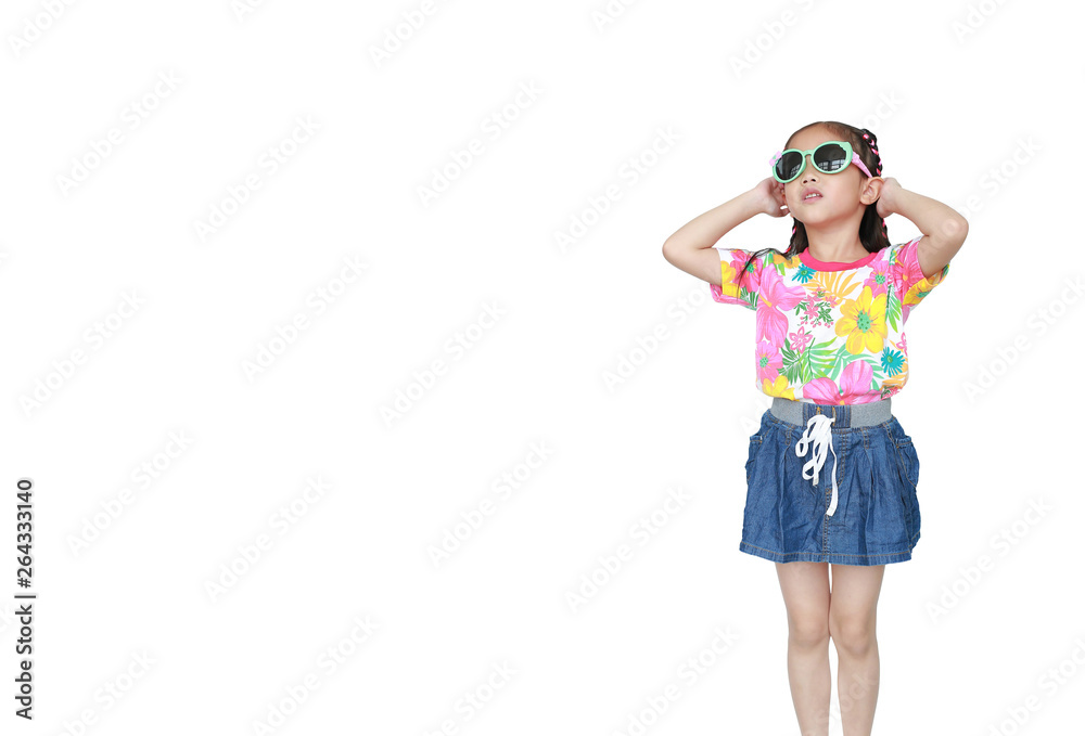 Cute little Asian kid girl wearing a flowers summer dress and sunglasses isolated on white background. Ready for summer vacation. Cute little Asian kid girl wearing a flowers summer dress and sunglasses isolated on white background. Ready for summer vacation.