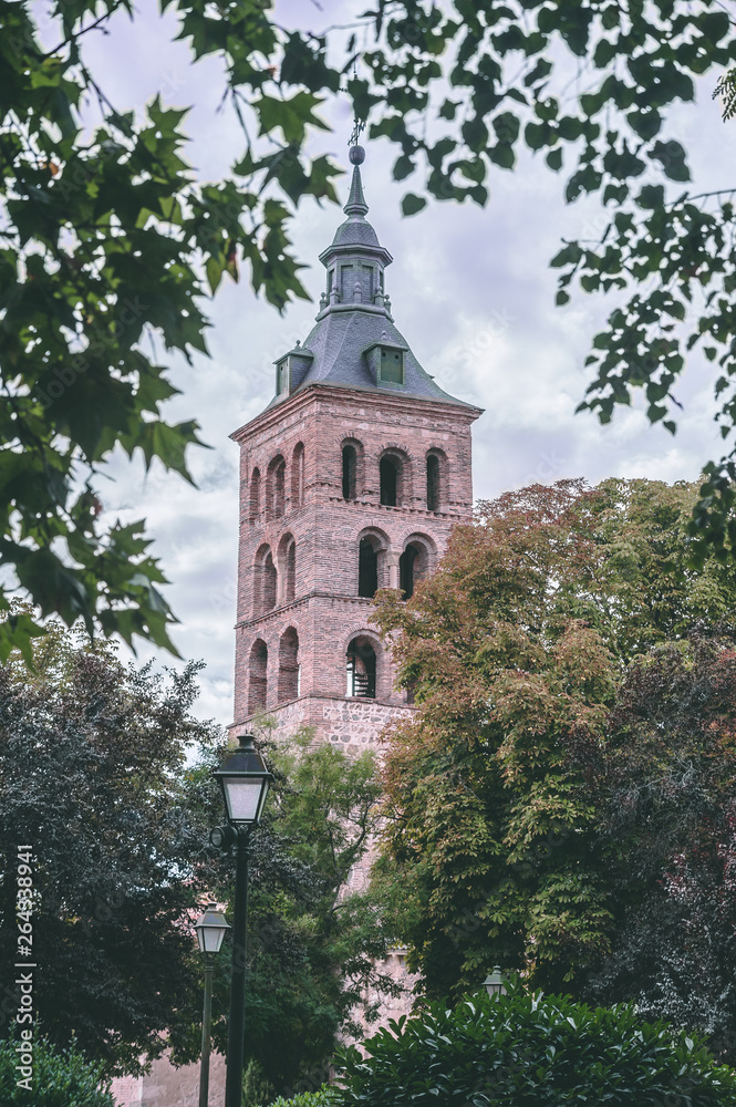 church tower among branches of trees
