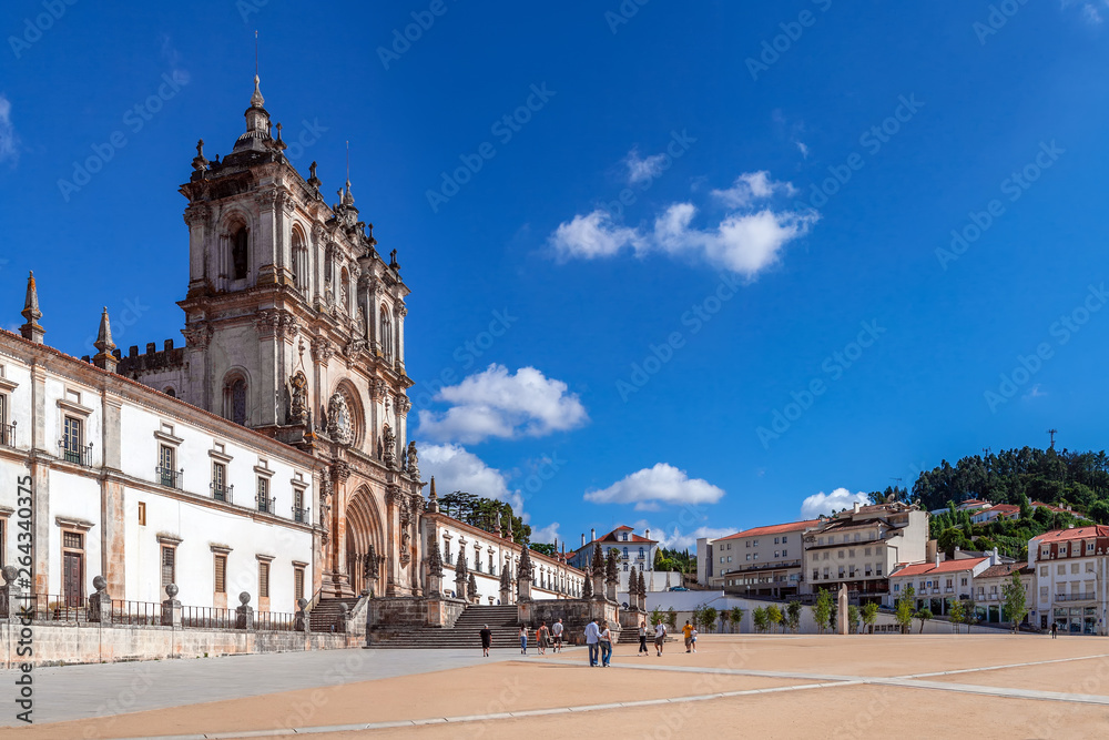 Alcobaca, Portugal. Exterior facade of Monastery of Santa Maria de Alcobaca Abbey. Masterpiece of Medieval Gothic architecture. Cistercian Religious Order