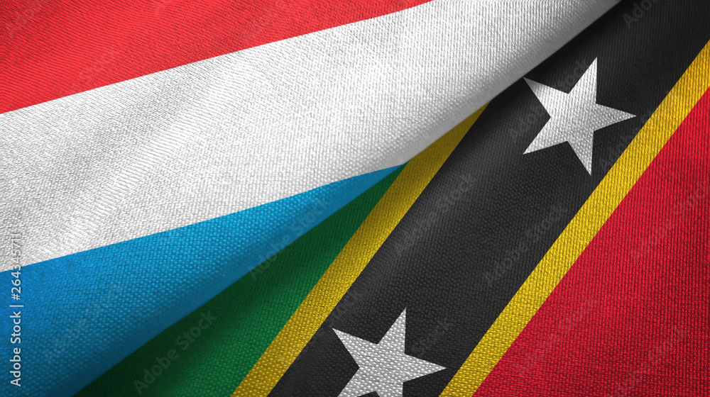 Fototapeta premium Luxembourg and Saint Kitts and Nevis two flags textile cloth, fabric texture