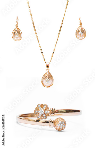 gold necklace bracelet and ear rings jewelry isolated on white background