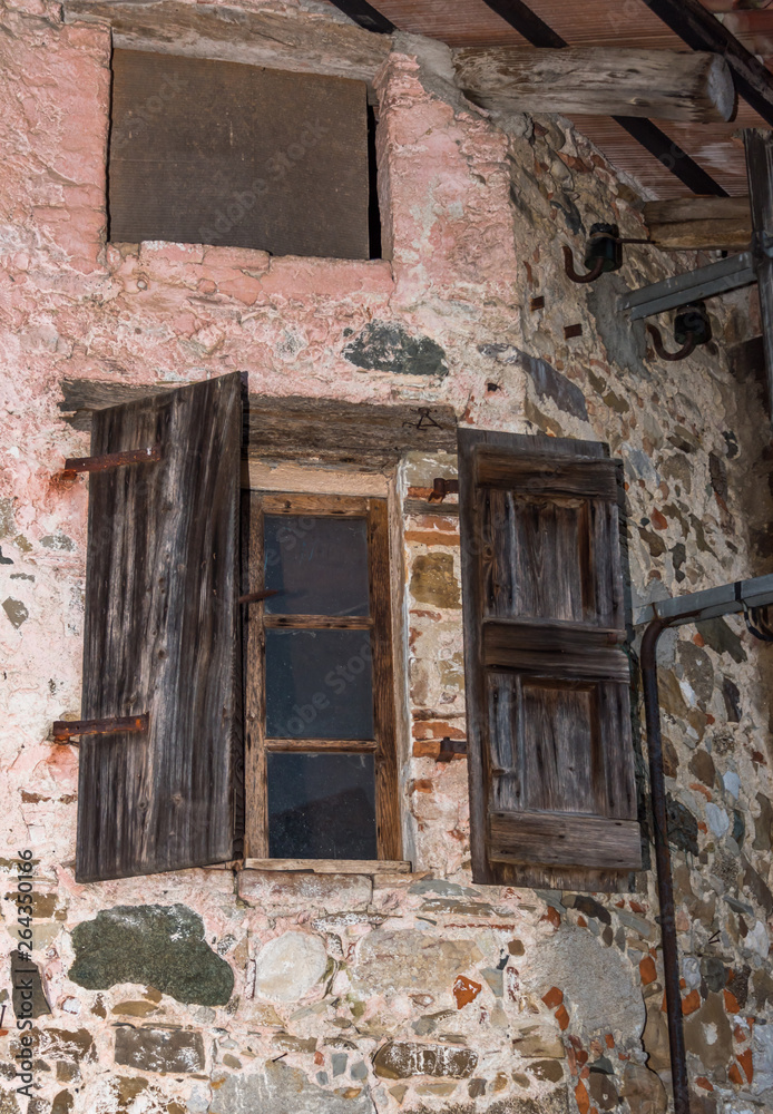 Wooden Window and Shutter on an Old Abandoned Stone House in Northern Italy