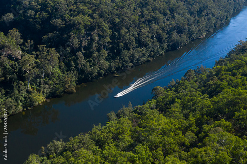 Water Skiing on the Nepean River flowing through Fairlight Gorge in New South Wales, Australia. photo