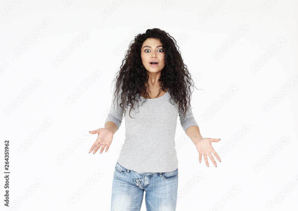lifestyle,emotion and people concept: surprised young casual girl shrugging shoulders lifestyle,emotion and people concept: surprised young casual girl shrugging shoulders