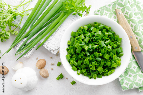 Slika na platnu Fresh green onion sliced in bowl