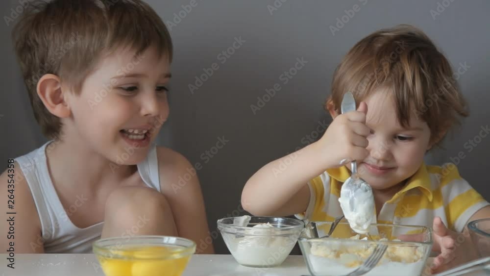 Children knead the dough. Add flour, sugar, eggs, butter Children knead the dough. Add flour, sugar, eggs, butter