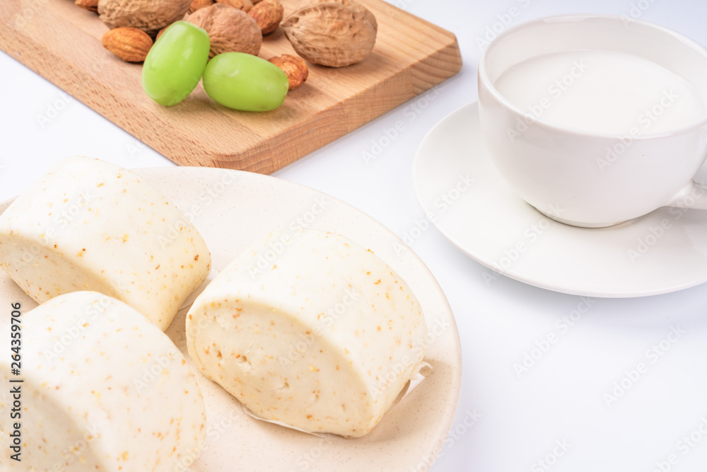 Dried fruit and milk bread on a white background