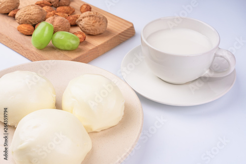 Dried fruit and milk bread on a white background